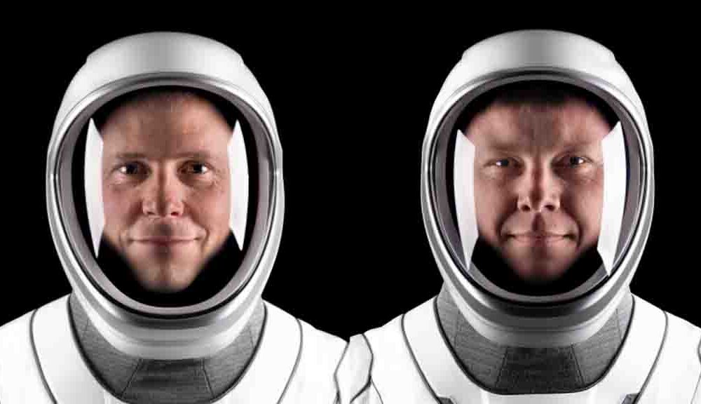 NASA astronaut Nick Hague (left) and Roscosmos cosmonaut Aleksandr Gorbunov pose for portraits in their flight suits at SpaceX headquarters in Hawthorne, California