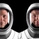 NASA astronaut Nick Hague (left) and Roscosmos cosmonaut Aleksandr Gorbunov pose for portraits in their flight suits at SpaceX headquarters in Hawthorne, California