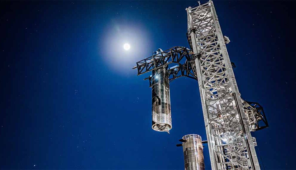 SpaceX Starbase launch tower stacking Starship on top of the Super Heavy Booster